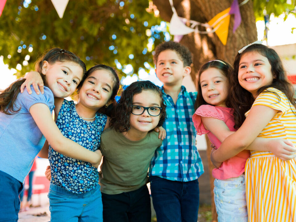 Cheerful preschool kids playing after school