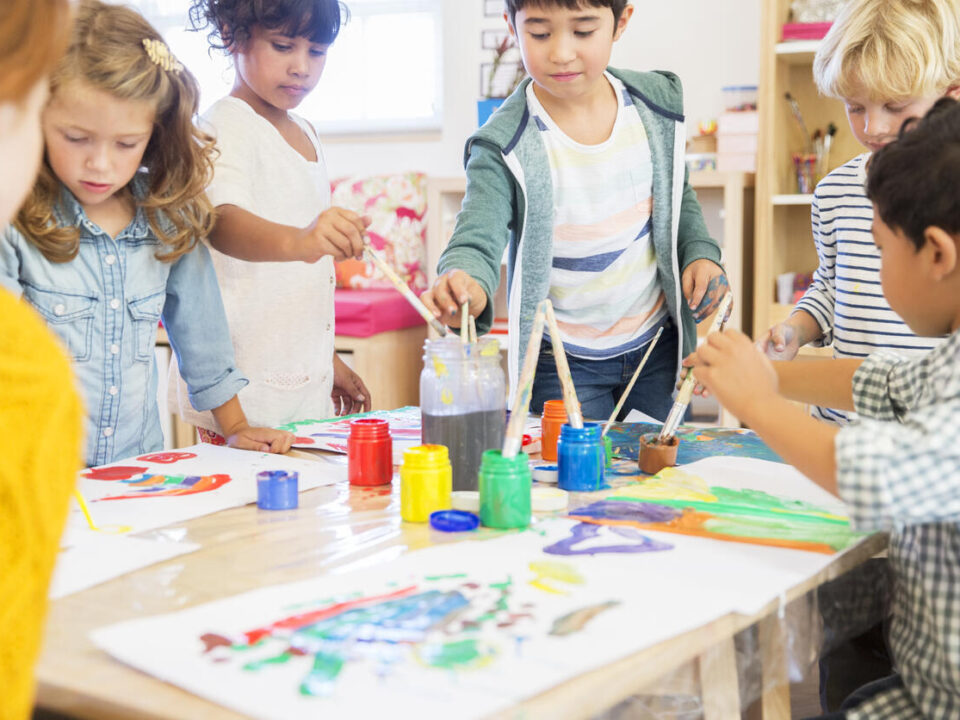 Students painting in classroom